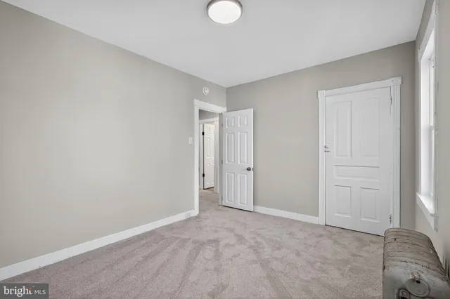 a view of an empty room and window