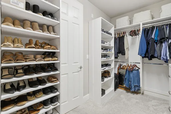 a bath room with a granite countertop sink and a mirror