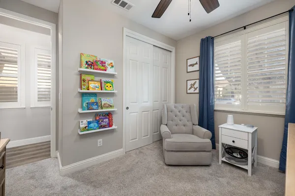 a view of a swimming pool with a lawn chairs