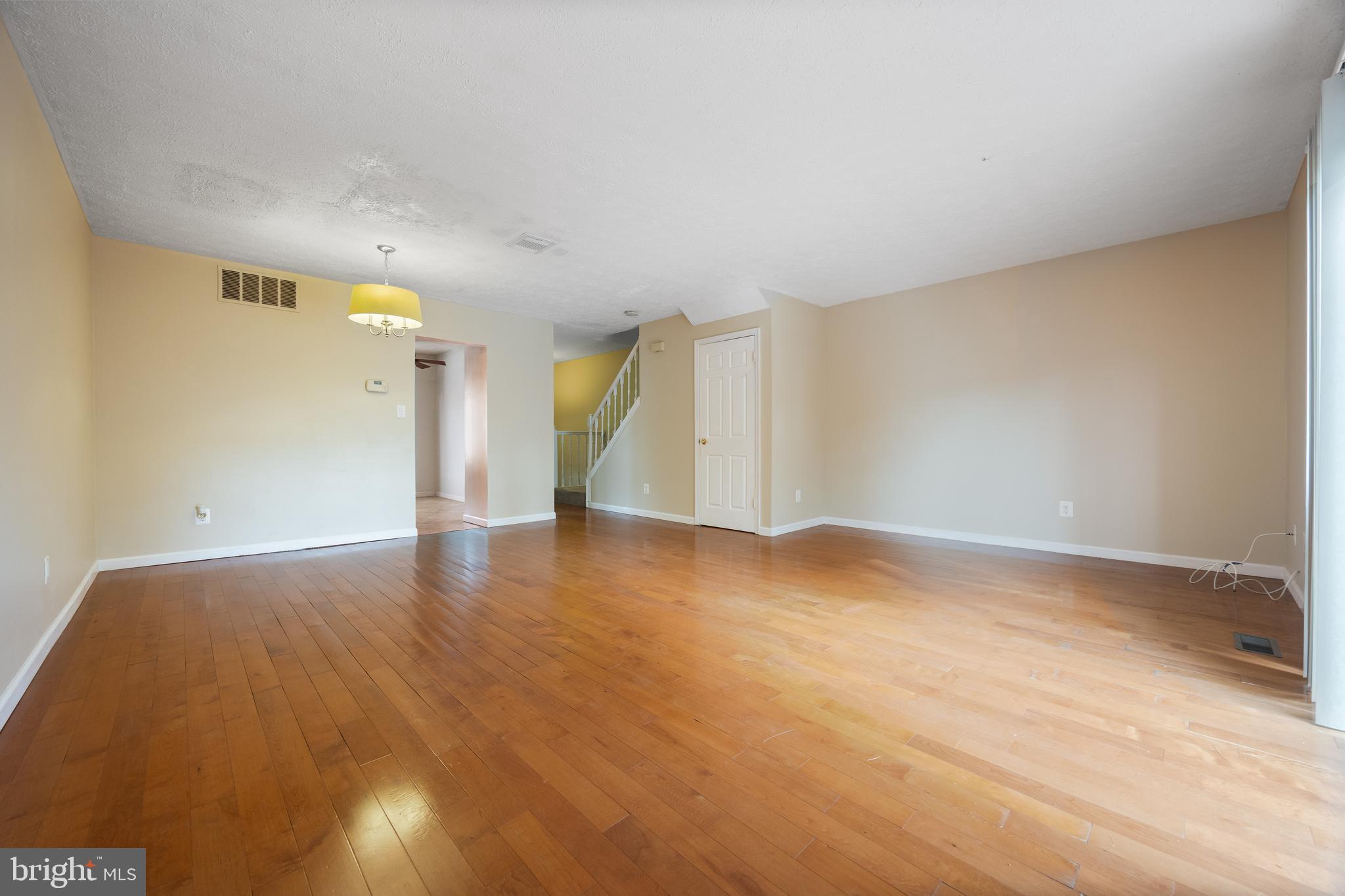 13 Sylvanhurst Court Baltimore, MD 21236 - Photo 12 of 35 a view of empty room with wooden floor
