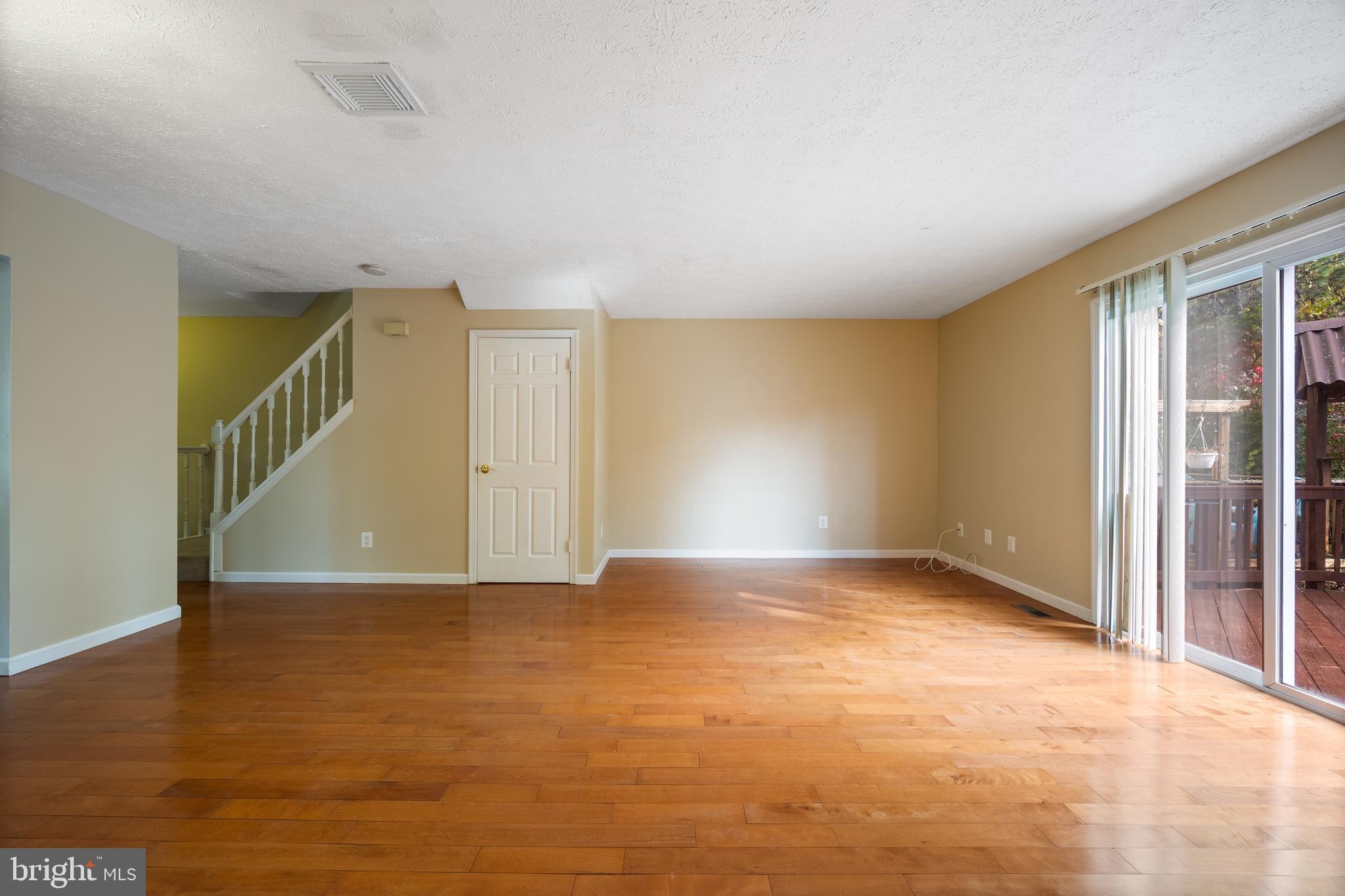 13 Sylvanhurst Court Baltimore, MD 21236 - Photo 14 of 35 a view of an empty room with wooden floor and a window