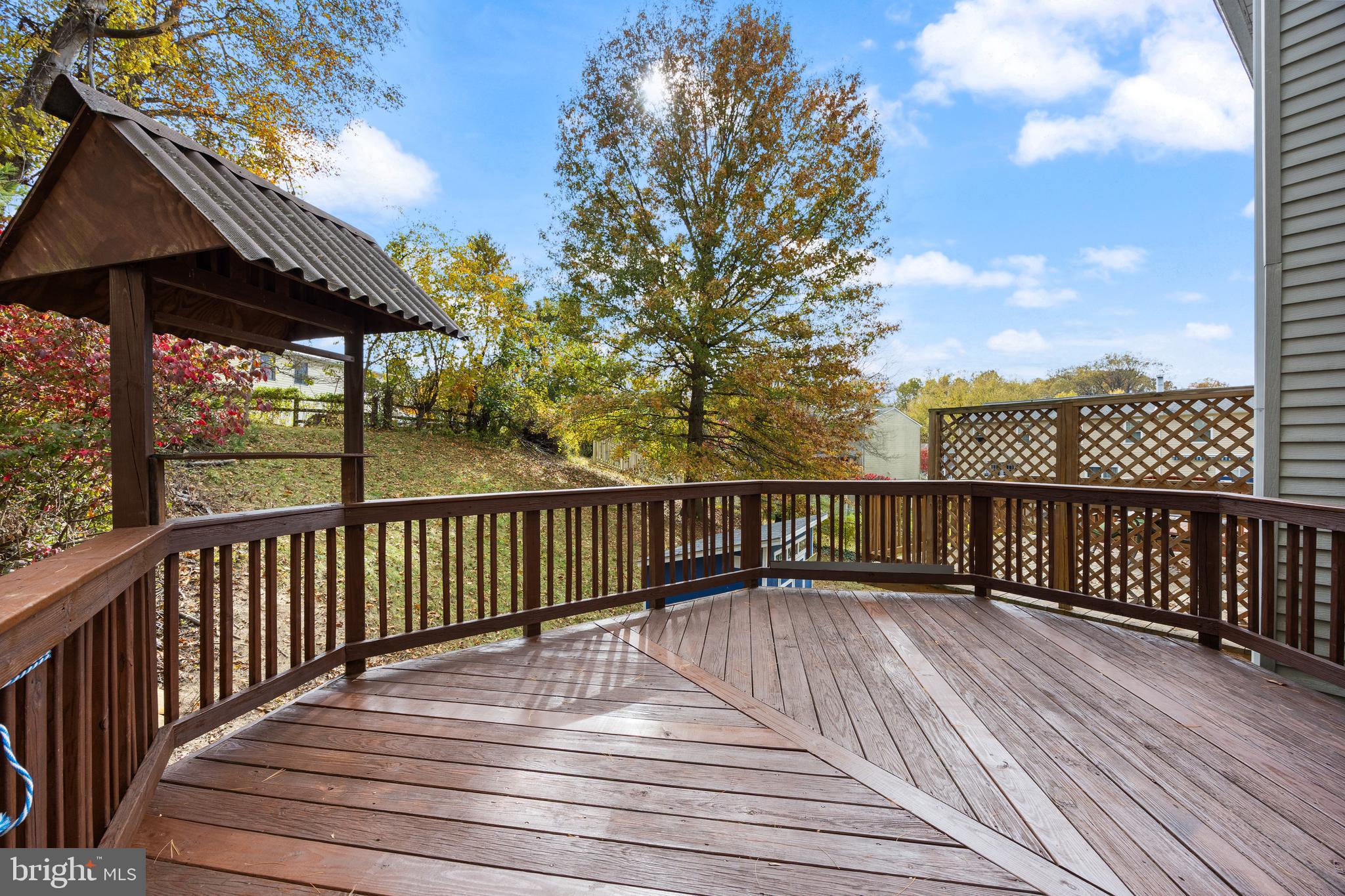 13 Sylvanhurst Court Baltimore, MD 21236 - Photo 15 of 35 a view of deck with wooden floor barbeque oven and trees