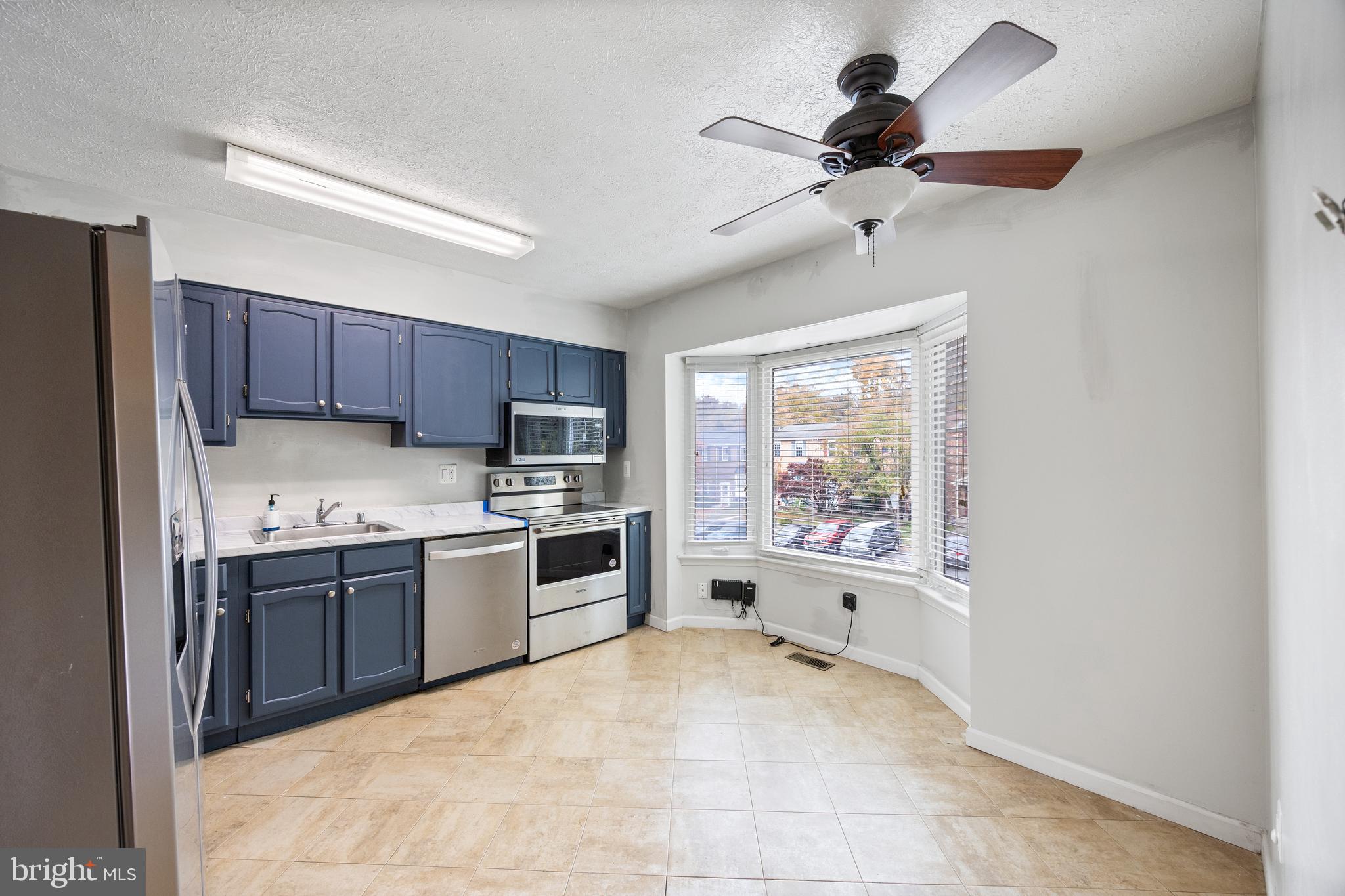 13 Sylvanhurst Court Baltimore, MD 21236 - Photo 3 of 35 a large kitchen with cabinets and stainless steel appliances