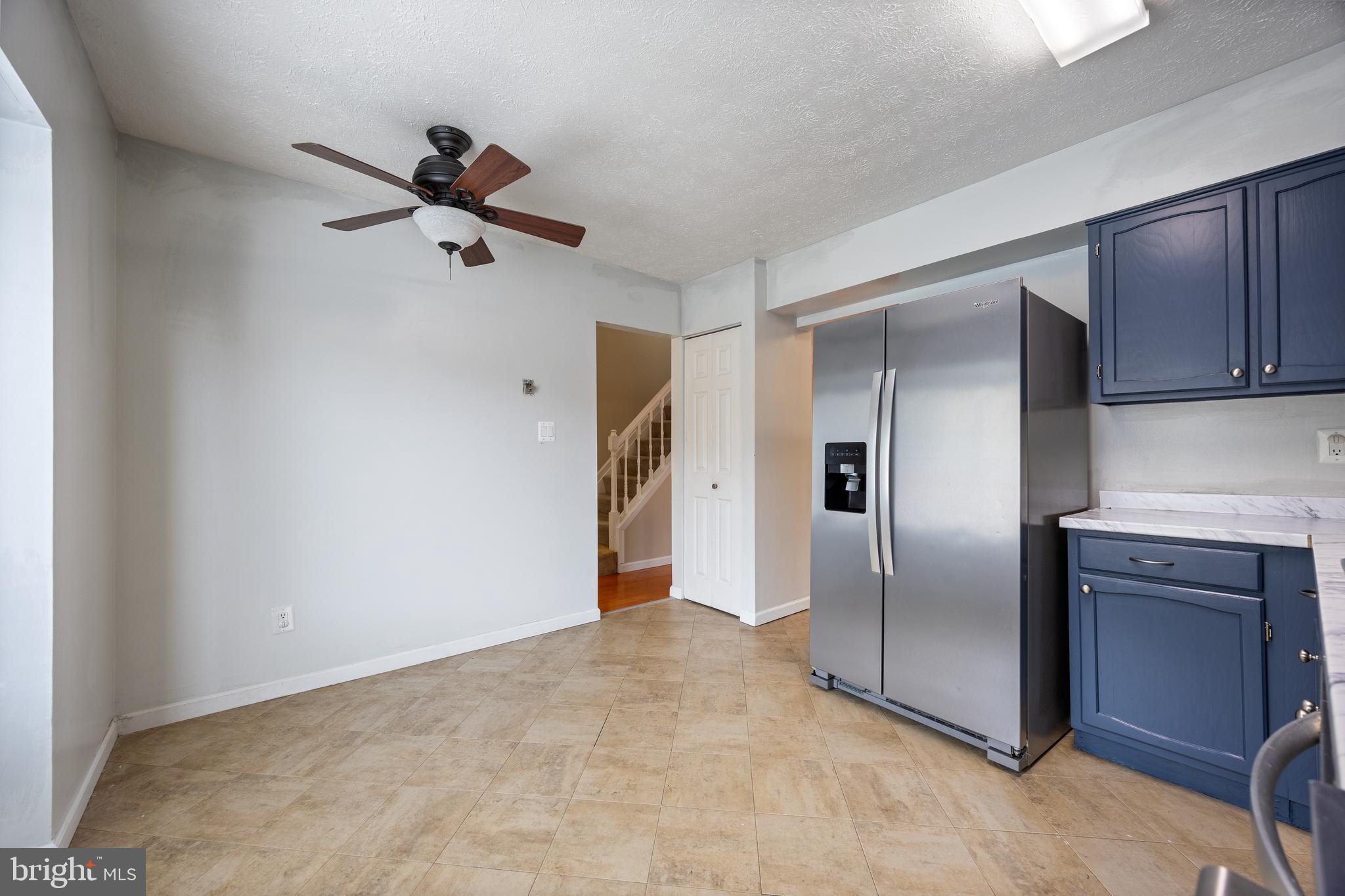 13 Sylvanhurst Court Baltimore, MD 21236 - Photo 7 of 35 a view of a kitchen with a sink and a refrigerator