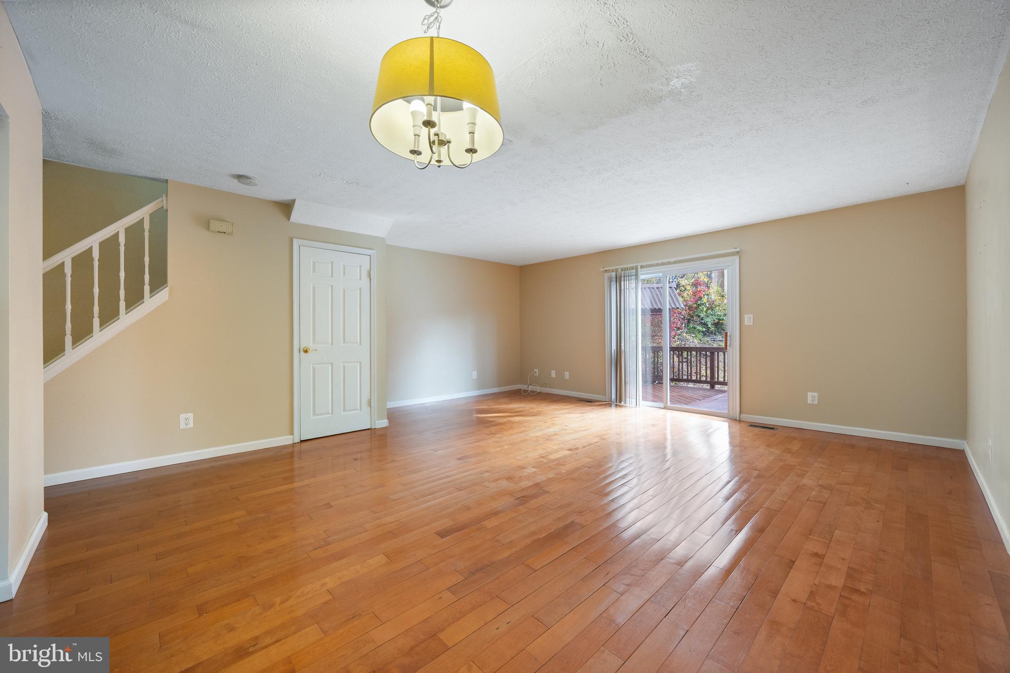 13 Sylvanhurst Court Baltimore, MD 21236 - Photo 10 of 35 a view of an empty room with wooden floor and a window