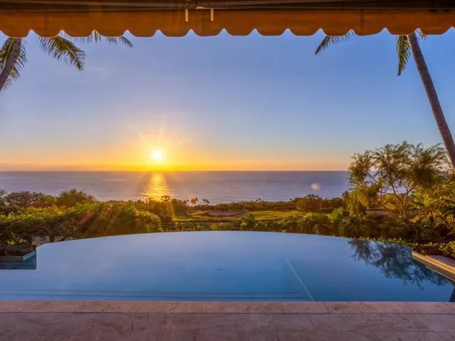 a view of an ocean and a yard