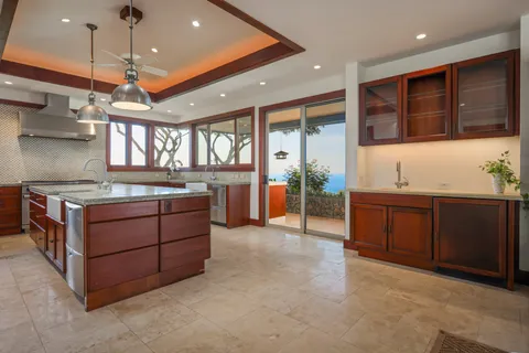 a kitchen with stainless steel appliances granite countertop a stove and a sink