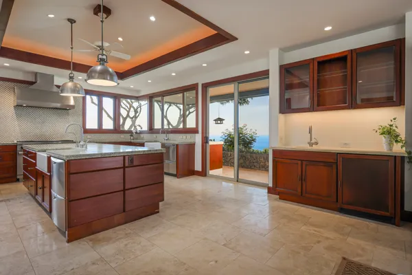 a kitchen with stainless steel appliances granite countertop a stove and a sink