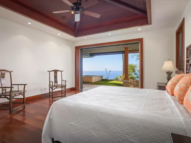 a view of a backyard with swimming pool