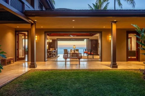 a view of a living room and hall way with furniture