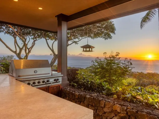 a view of a swimming pool with an outdoor seating