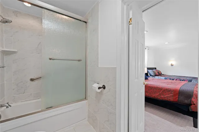 a en suite bathroom with a shower and a tub