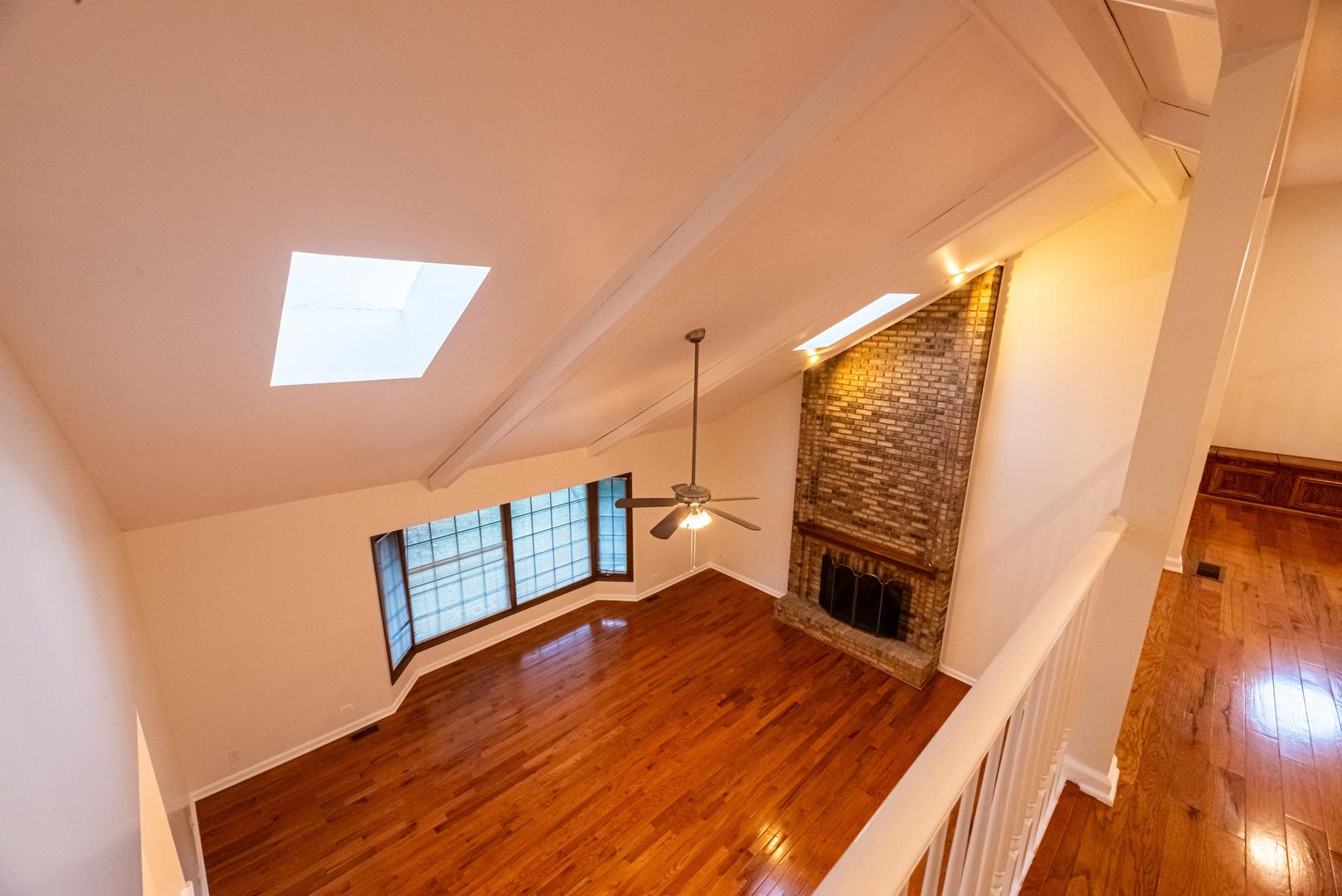 3021 35th Street Oak Brook, IL 60523 - Photo 14 of 32 a view of an empty room with wooden floor and a window