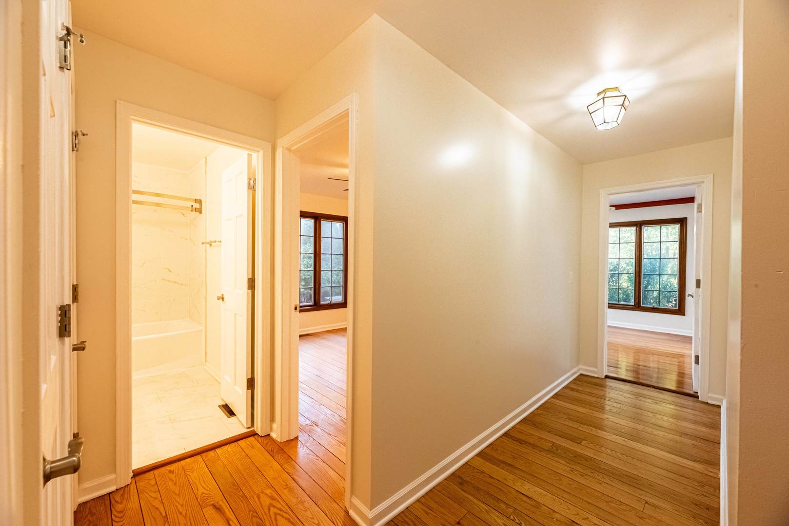 3021 35th Street Oak Brook, IL 60523 - Photo 15 of 32 a view of a room with wooden floor and a bathroom