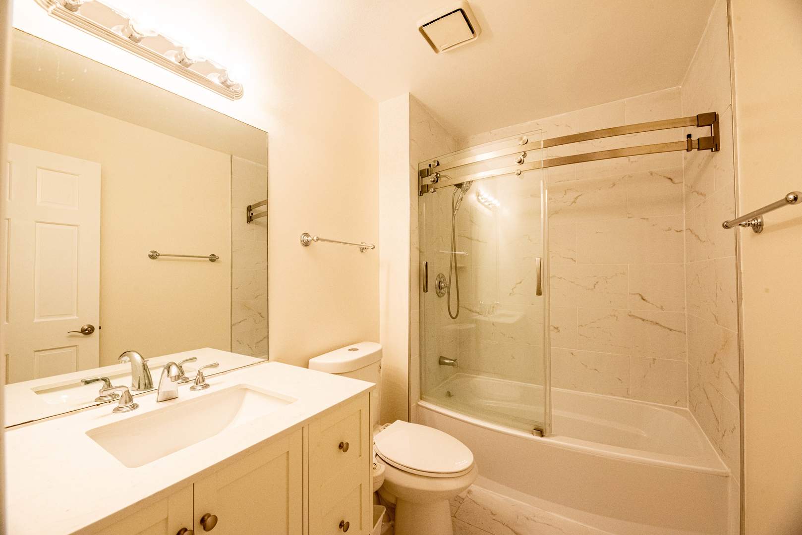 3021 35th Street Oak Brook, IL 60523 - Photo 18 of 32 a bathroom with a sink mirror toilet and shower
