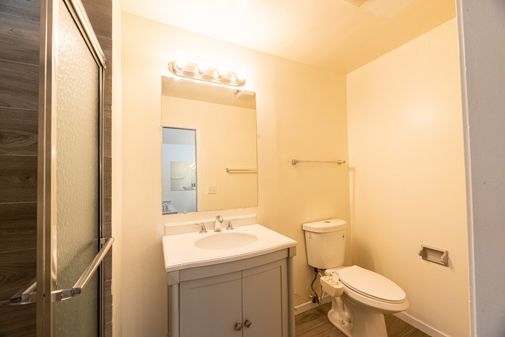 3021 35th Street Oak Brook, IL 60523 - Photo 23 of 32 a bathroom with a sink a toilet and a mirror