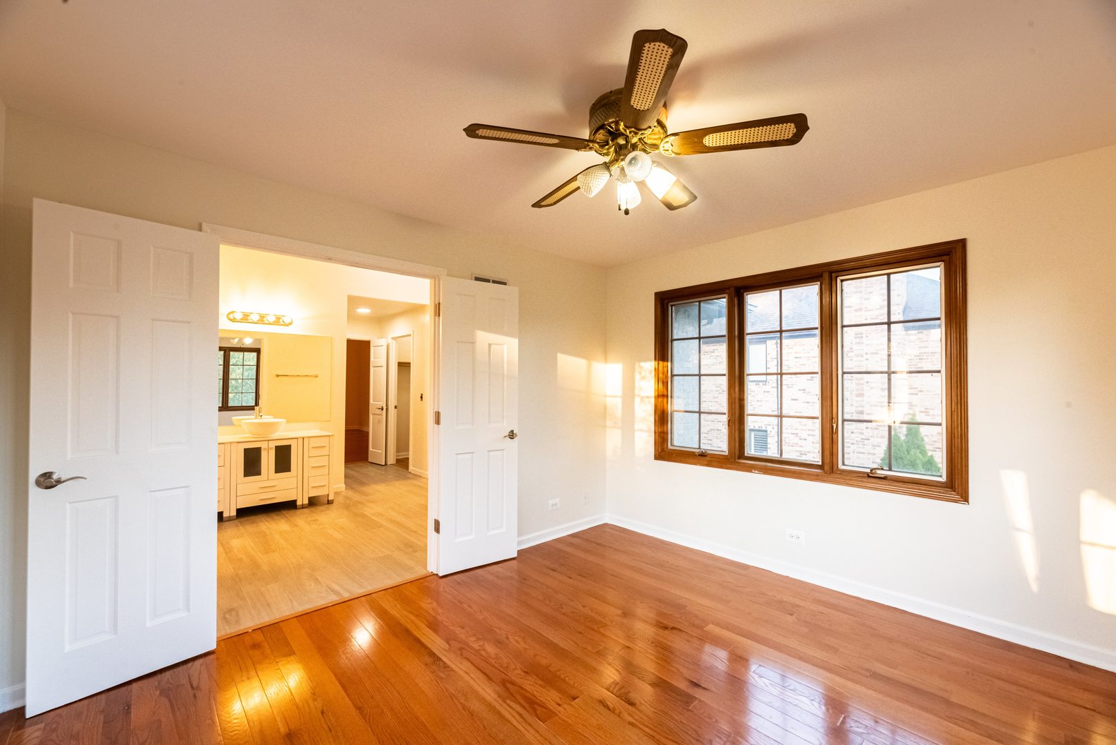 3021 35th Street Oak Brook, IL 60523 - Photo 24 of 32 a bedroom with a bed and wooden floor