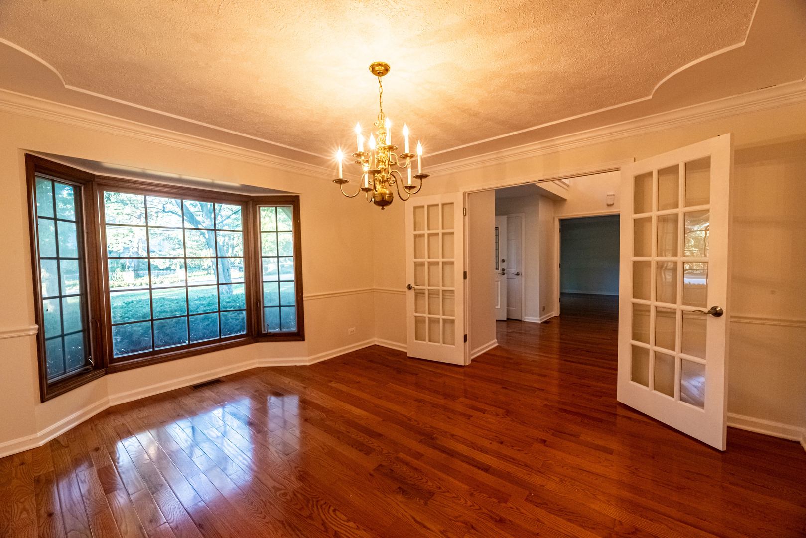 3021 35th Street Oak Brook, IL 60523 - Photo 7 of 32 a view of a room with wooden floor and balcony