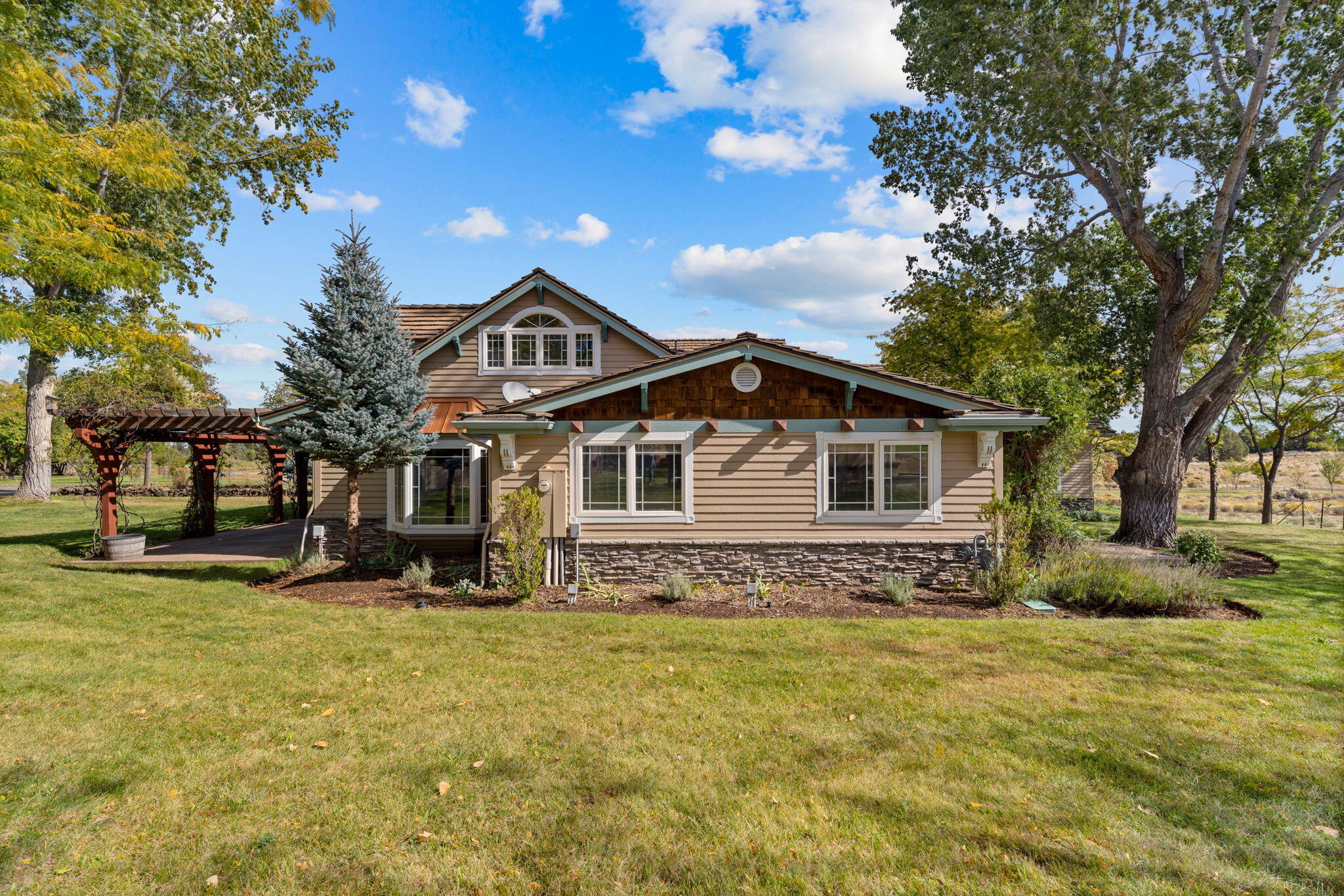 21925 Bear Creek Road Bend, OR 97702 - Photo 79 of 104 a house with trees in the background