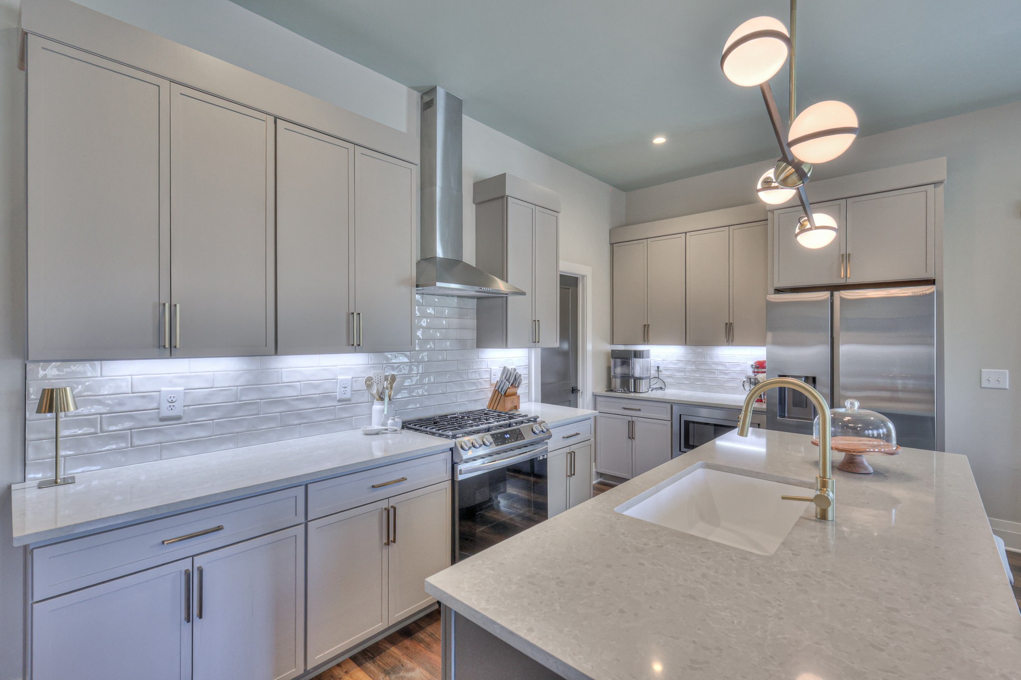 1108 Noble Loop Nashville, TN 37211 - Photo 11 of 45 a kitchen with a sink a stove cabinets and counter space