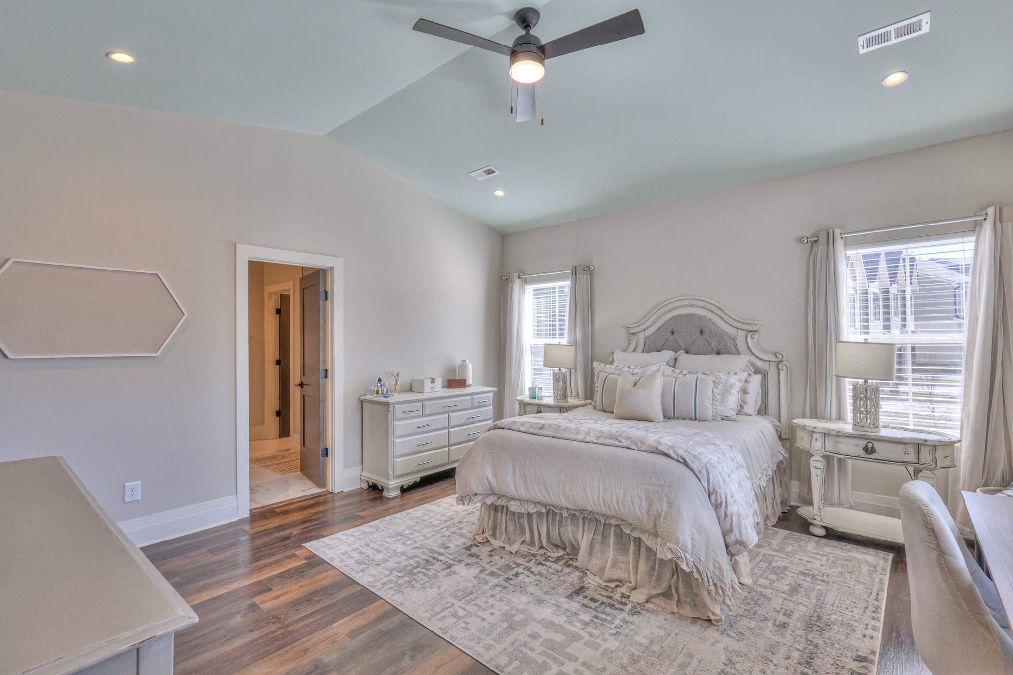 1108 Noble Loop Nashville, TN 37211 - Photo 19 of 45 a bedroom with a large bed and a chandelier