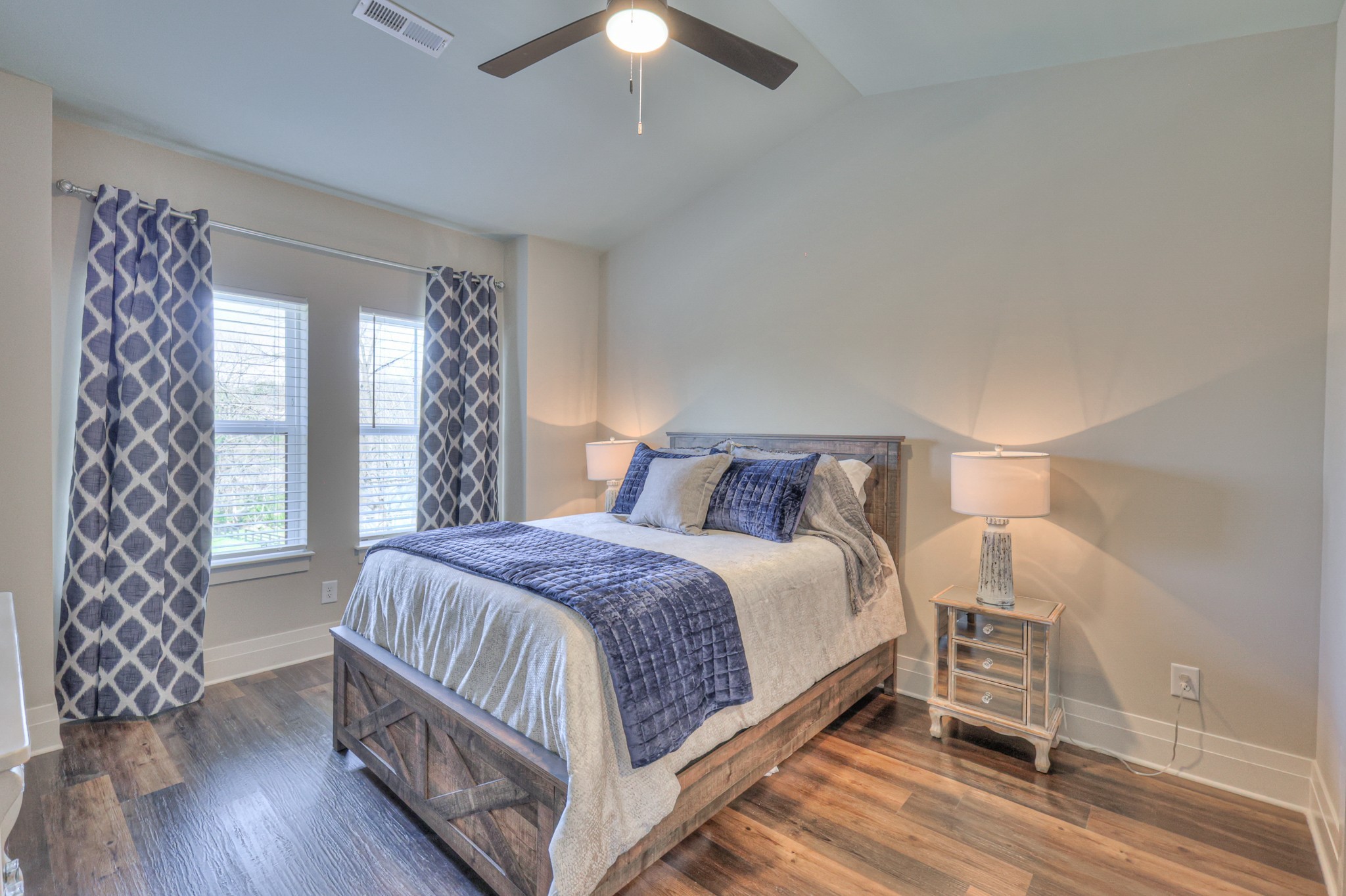 1108 Noble Loop Nashville, TN 37211 - Photo 28 of 45 a bedroom with a bed and a chandelier