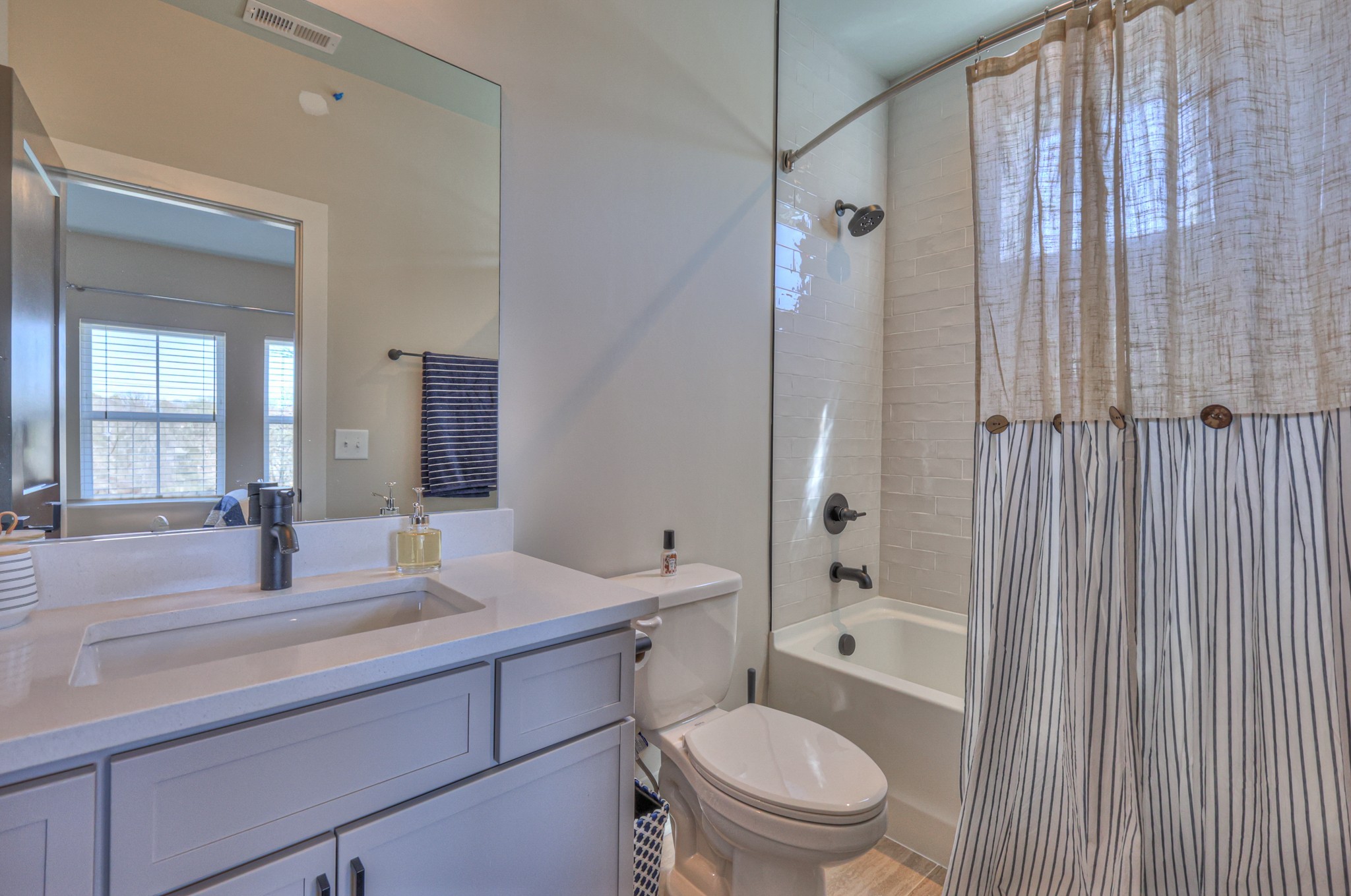 1108 Noble Loop Nashville, TN 37211 - Photo 35 of 45 a bathroom with a granite countertop sink a toilet a mirror and shower