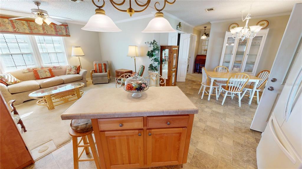 10101 Burnt Store Road, Unit 141 Punta Gorda, FL 33950 - Photo 11 of 34 a view of a dining room with furniture and wooden floor