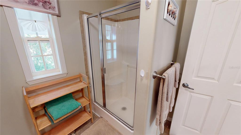 10101 Burnt Store Road, Unit 141 Punta Gorda, FL 33950 - Photo 15 of 34 a bathroom with a mirror and a shower