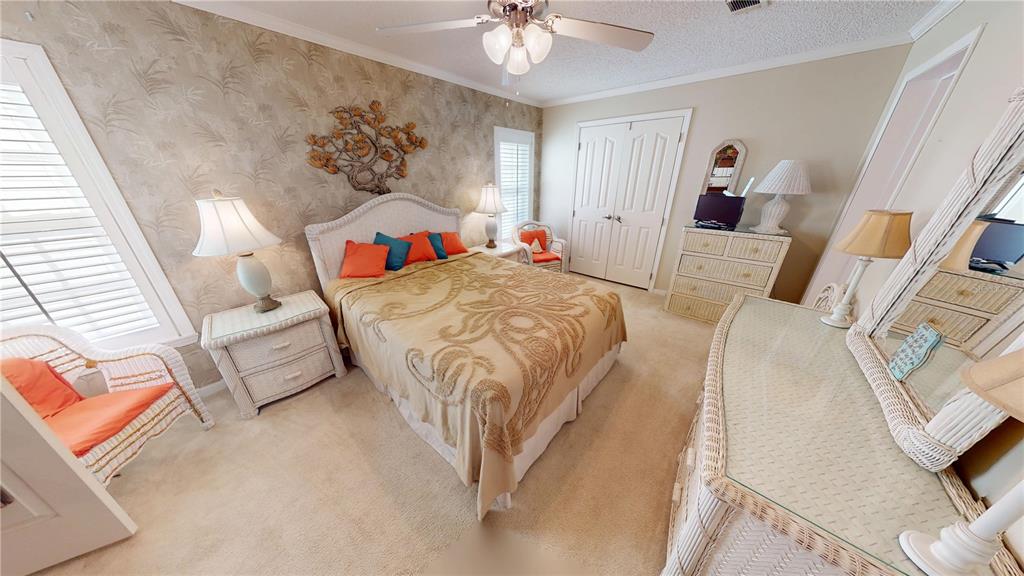 10101 Burnt Store Road, Unit 141 Punta Gorda, FL 33950 - Photo 16 of 34 a bed room with a bed