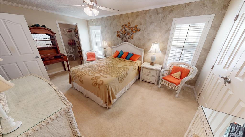 10101 Burnt Store Road, Unit 141 Punta Gorda, FL 33950 - Photo 19 of 34 a bedroom with a bed and a window