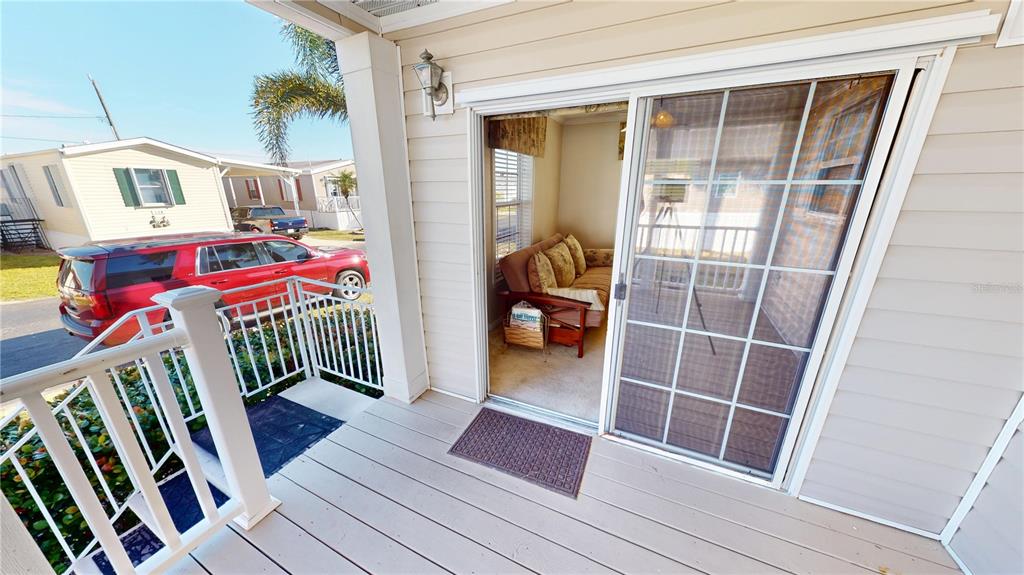 10101 Burnt Store Road, Unit 141 Punta Gorda, FL 33950 - Photo 2 of 34 a view of front door deck and furniture