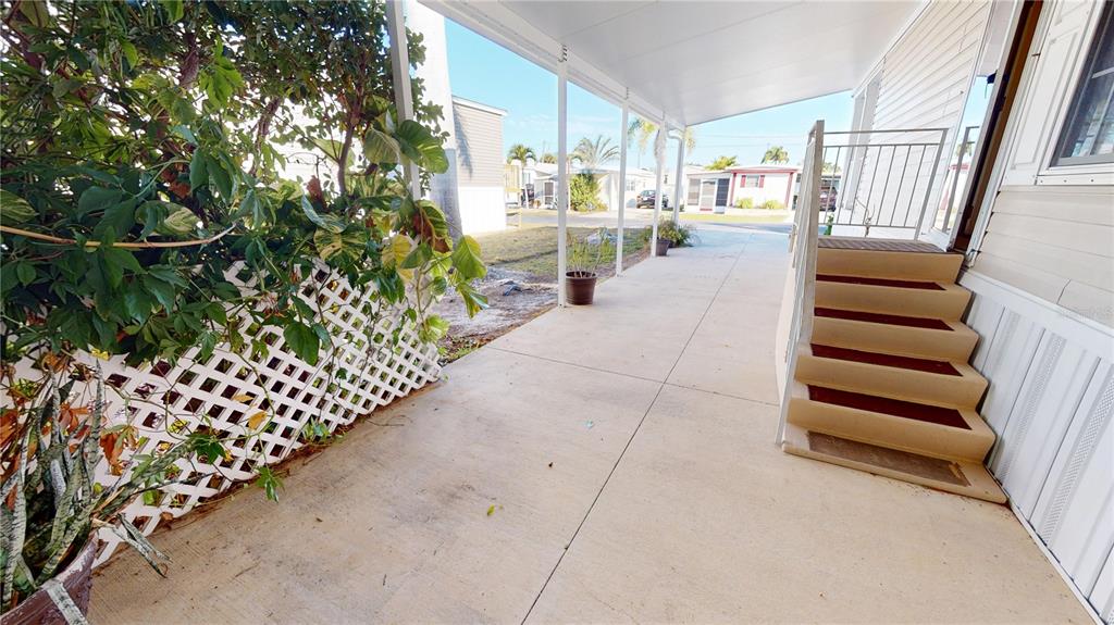 10101 Burnt Store Road, Unit 141 Punta Gorda, FL 33950 - Photo 22 of 34 a view of entryway with wooden floor