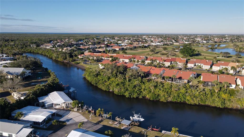 10101 Burnt Store Road, Unit 141 Punta Gorda, FL 33950 - Photo 25 of 34 an aerial view of a houses with a yard