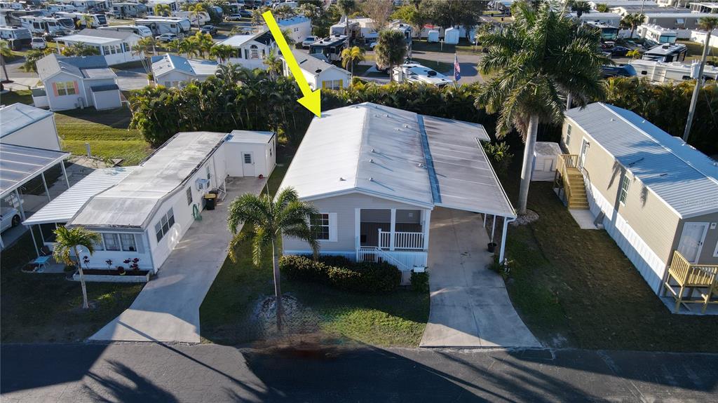 10101 Burnt Store Road, Unit 141 Punta Gorda, FL 33950 - Photo 29 of 34 an aerial view of house with yard