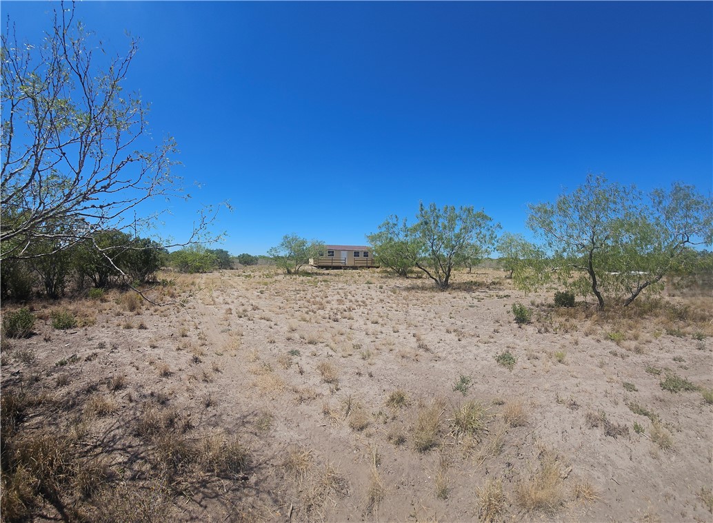 0 Tract 59 Benavides, TX 78341 - Photo 5 of 32 a view of dirt field with trees in background