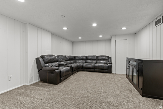 2101 West 3900th Street South Roy, UT 84067 - Photo 28 of 36 Spacious room featuring neutral carpet flooring, recessed lighting, and white board-and-batten wall paneling