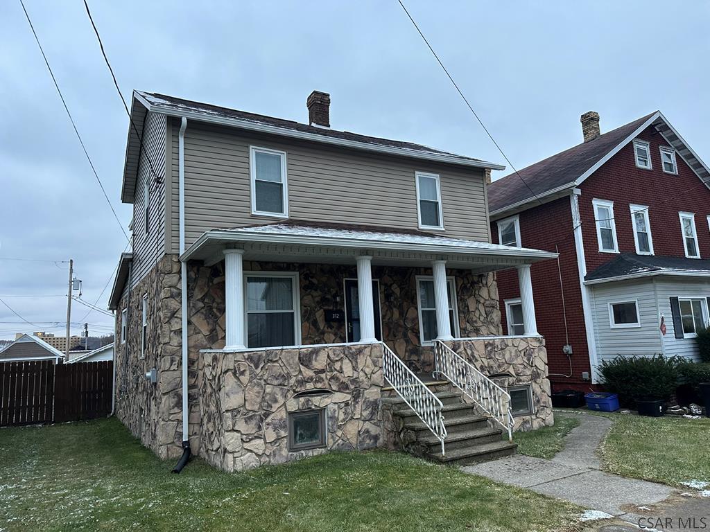 312 12th Street Windber, PA 15963 - Photo 1 of 24 a front view of a house with garden
