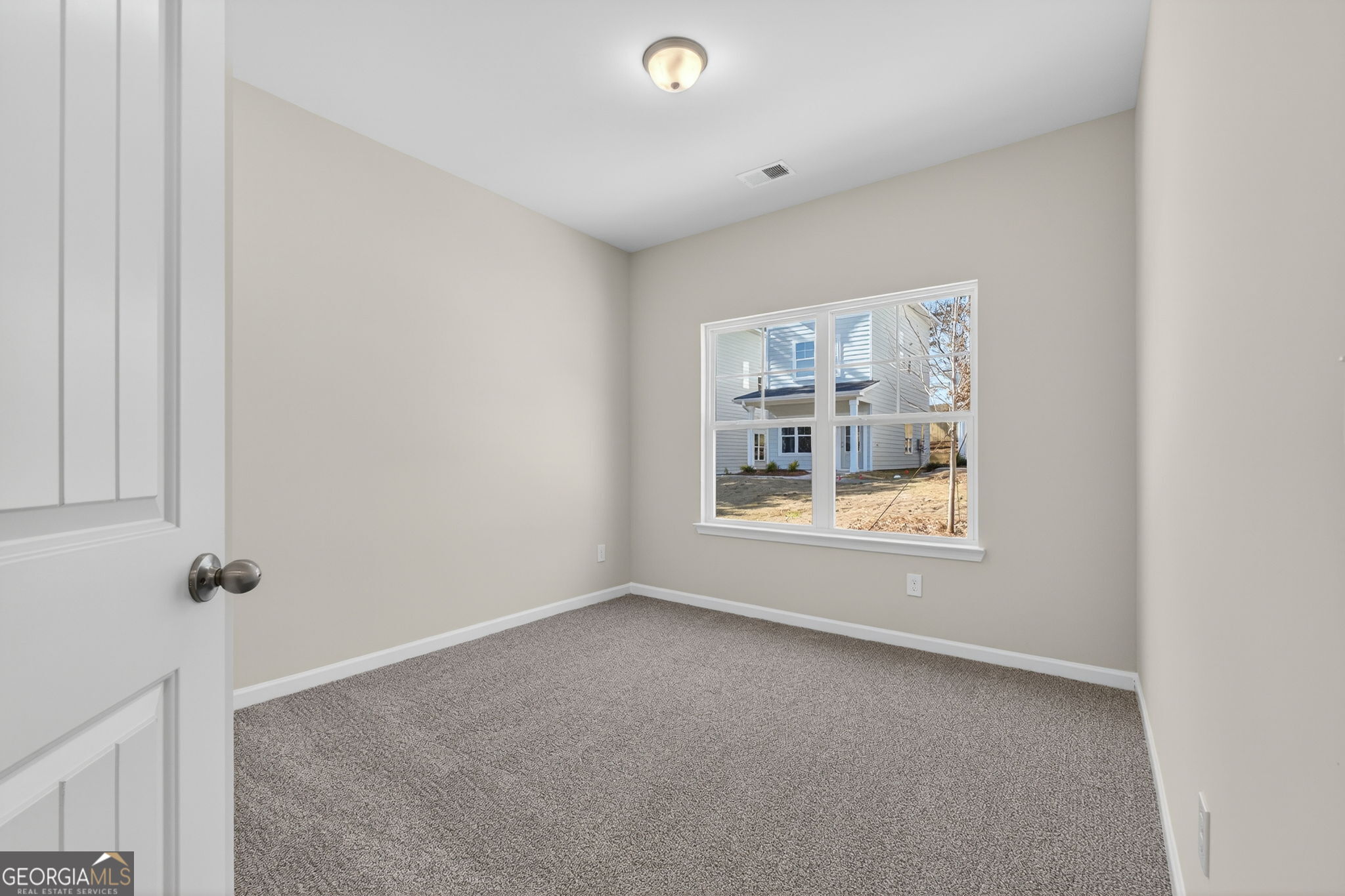 207 Riverview Road Franklin, GA 30217 - Photo 16 of 24 a view of an empty room with a window