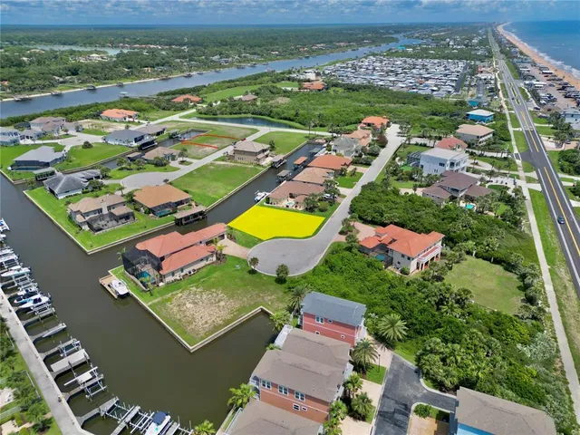 an aerial view of a pool a yard and outdoor seating