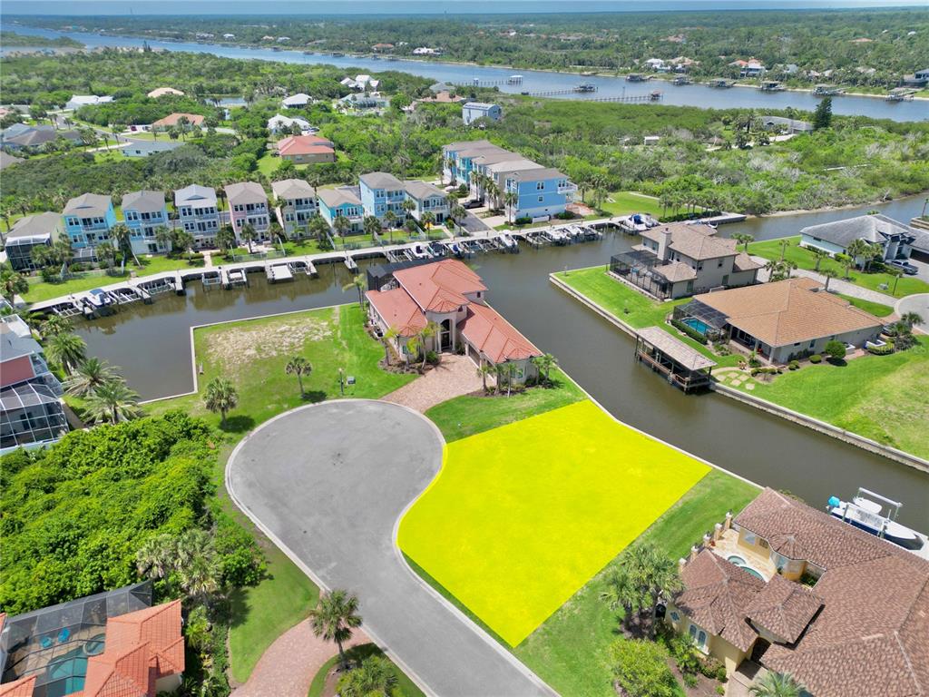 90 Hidden Cove Beverly Beach, FL 32136 - Photo 2 of 11 an aerial view of a resort with swimming pool outdoor seating
