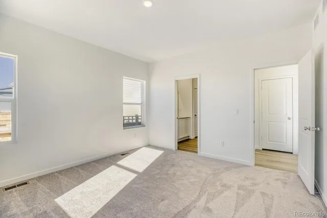 a view of a building next to a yard