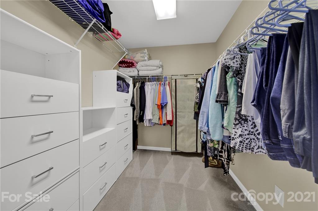 4509 Shadow Moss Circle Fort Mill, SC 29708 - Photo 18 of 43 a view of walk in closet with clothes and shoes