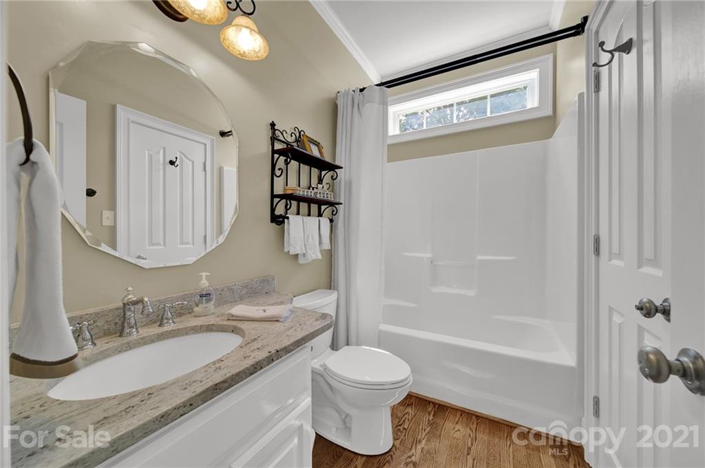 4509 Shadow Moss Circle Fort Mill, SC 29708 - Photo 20 of 43 a bathroom with a granite countertop sink toilet and shower