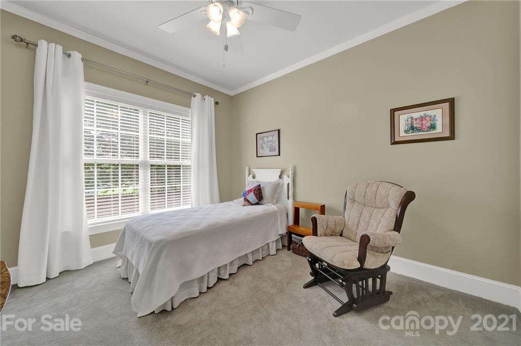 4509 Shadow Moss Circle Fort Mill, SC 29708 - Photo 21 of 43 a bedroom with a bed and a window