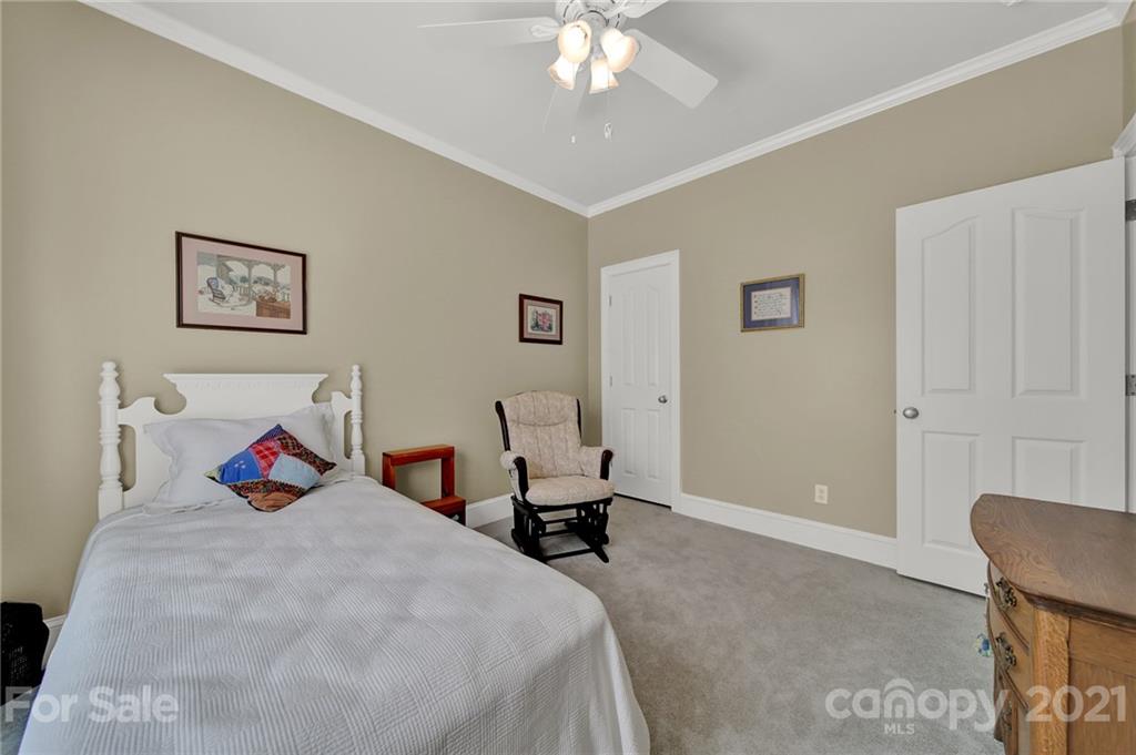 4509 Shadow Moss Circle Fort Mill, SC 29708 - Photo 22 of 43 a bedroom with a bed and chair