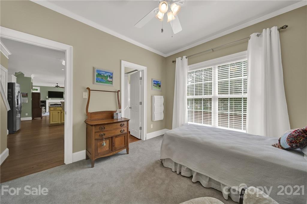 4509 Shadow Moss Circle Fort Mill, SC 29708 - Photo 23 of 43 a spacious bedroom with a bed and a large window
