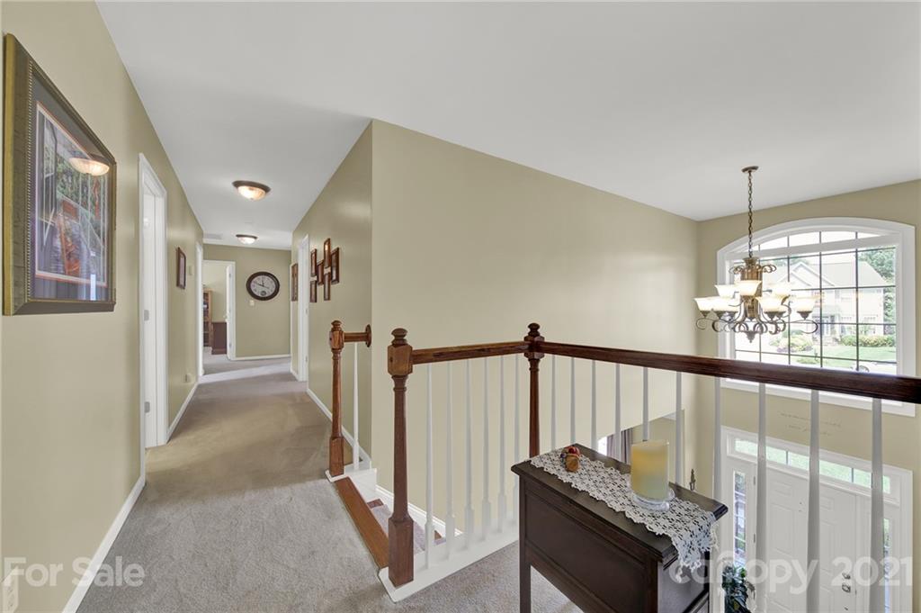 4509 Shadow Moss Circle Fort Mill, SC 29708 - Photo 24 of 43 a view of a hallway with furniture and windows
