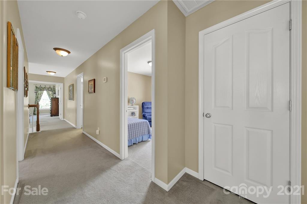 4509 Shadow Moss Circle Fort Mill, SC 29708 - Photo 25 of 43 a view of a hallway with two rooms