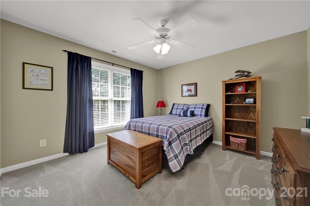 4509 Shadow Moss Circle Fort Mill, SC 29708 - Photo 26 of 43 a spacious bedroom with a bed and a large window